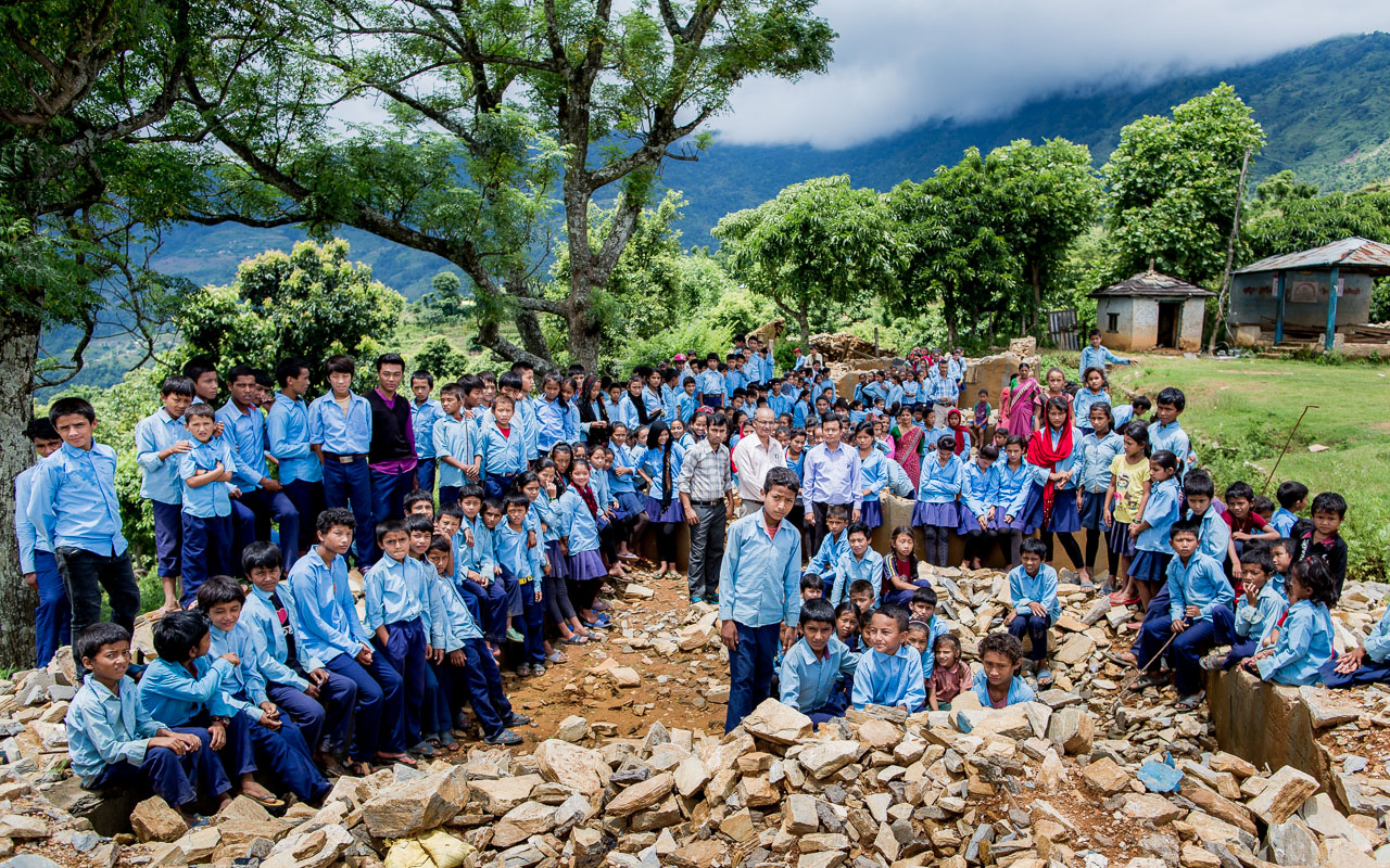 All the students amongst the ruins of their school.