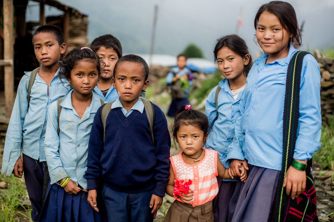 Students arriving home in their village.