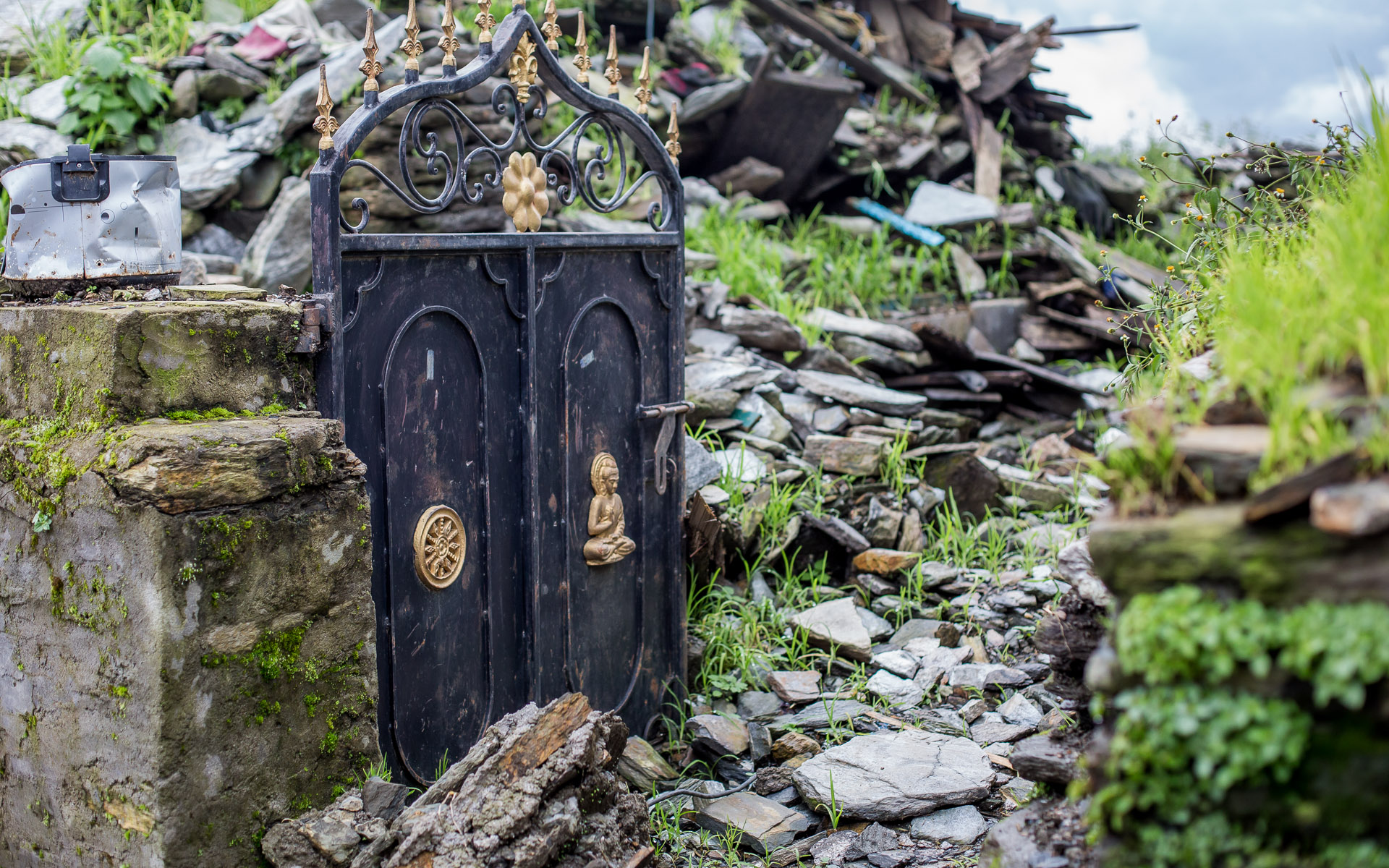The gate is the only part left of this house.