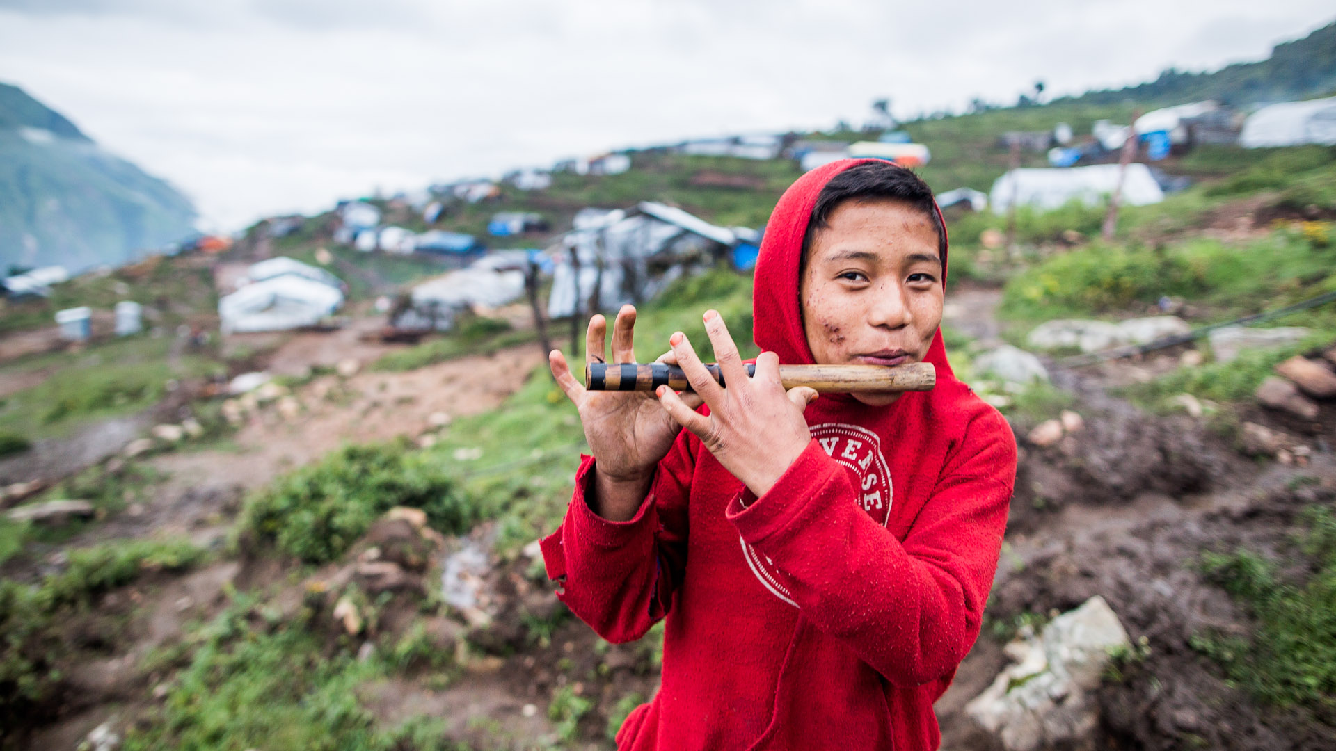  Boy playing his traditional Gurung flute just before sunrise. 
