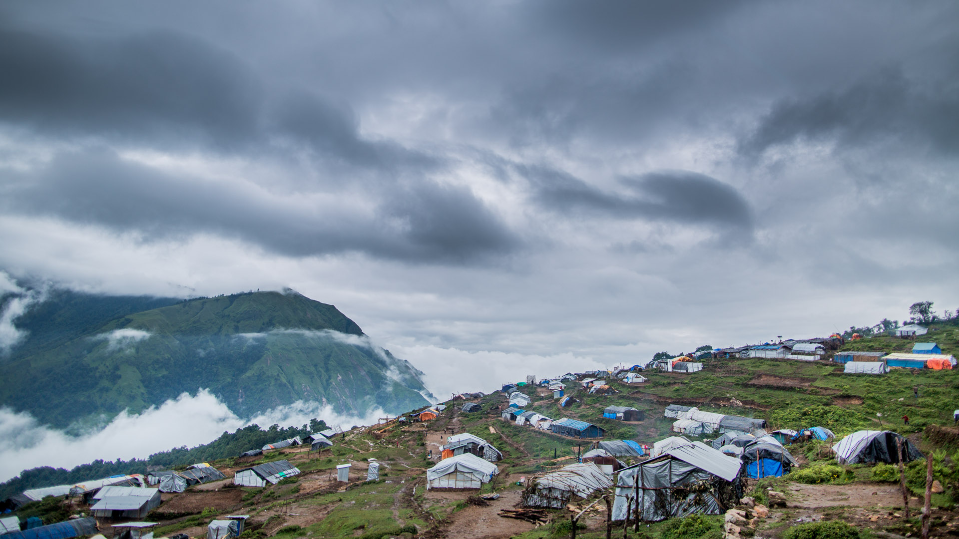Arriving in Laprak it was sad to see the people living in plastic shelters, far from their old houses down in the valley. 