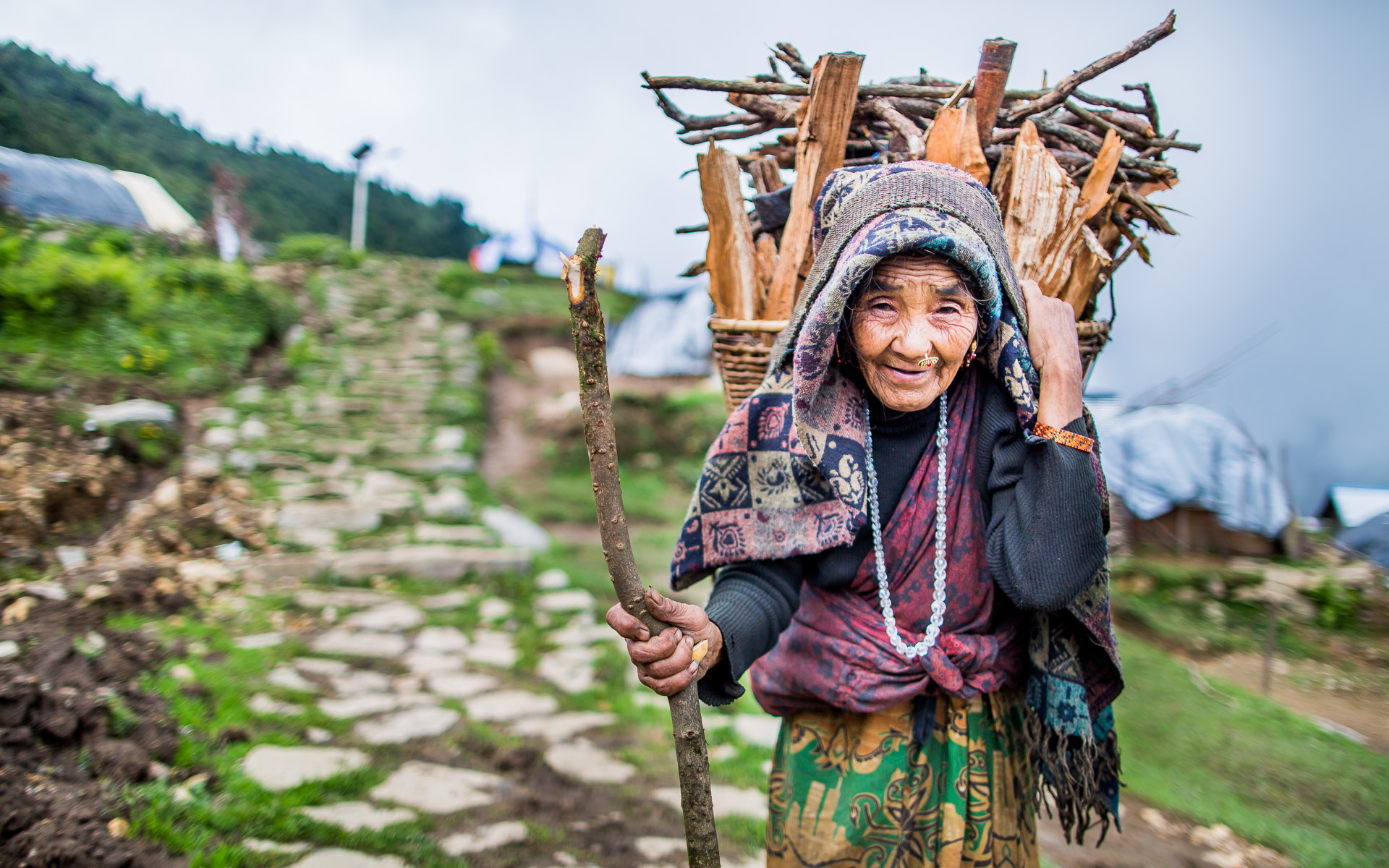 Just before sunset this lady came back from the forest to light her fire for cooking and warmth during the evening.