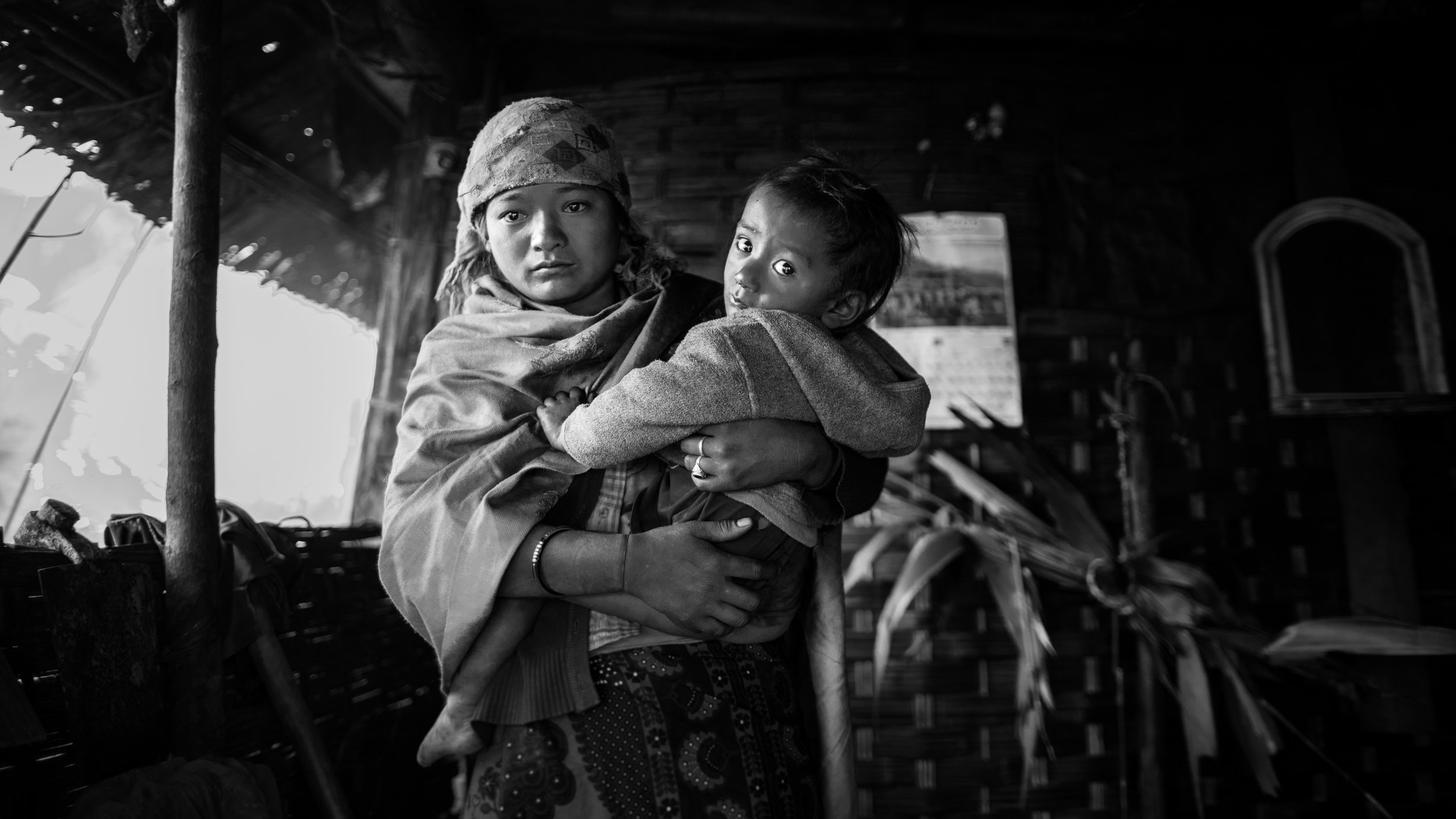 Lady with child in the very remote jungle village of Obak. Mentioned by the billagers was that we where the first white people to visit their village.