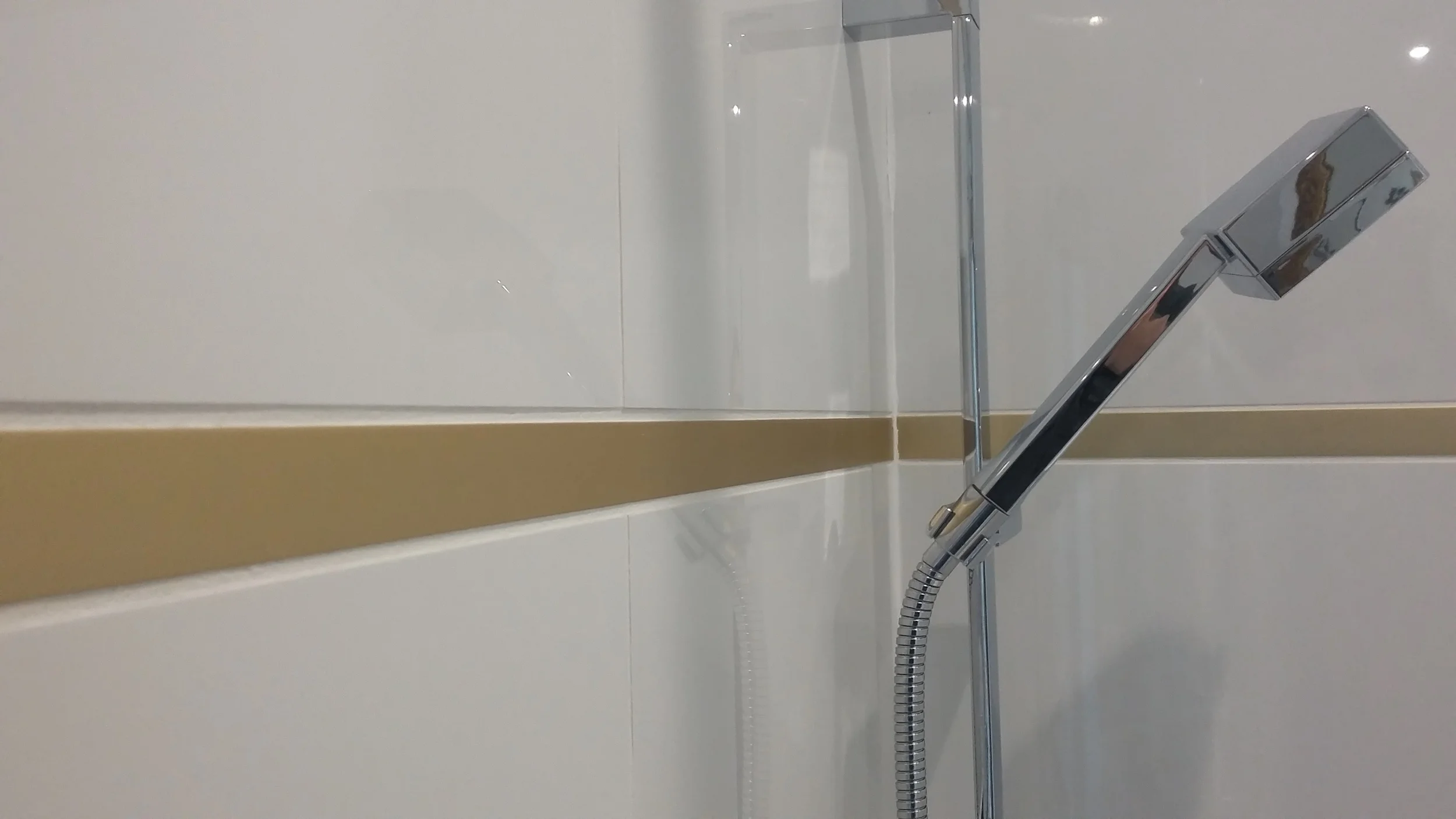 Aurora white and gold bathroom and shower tile installation 12x24