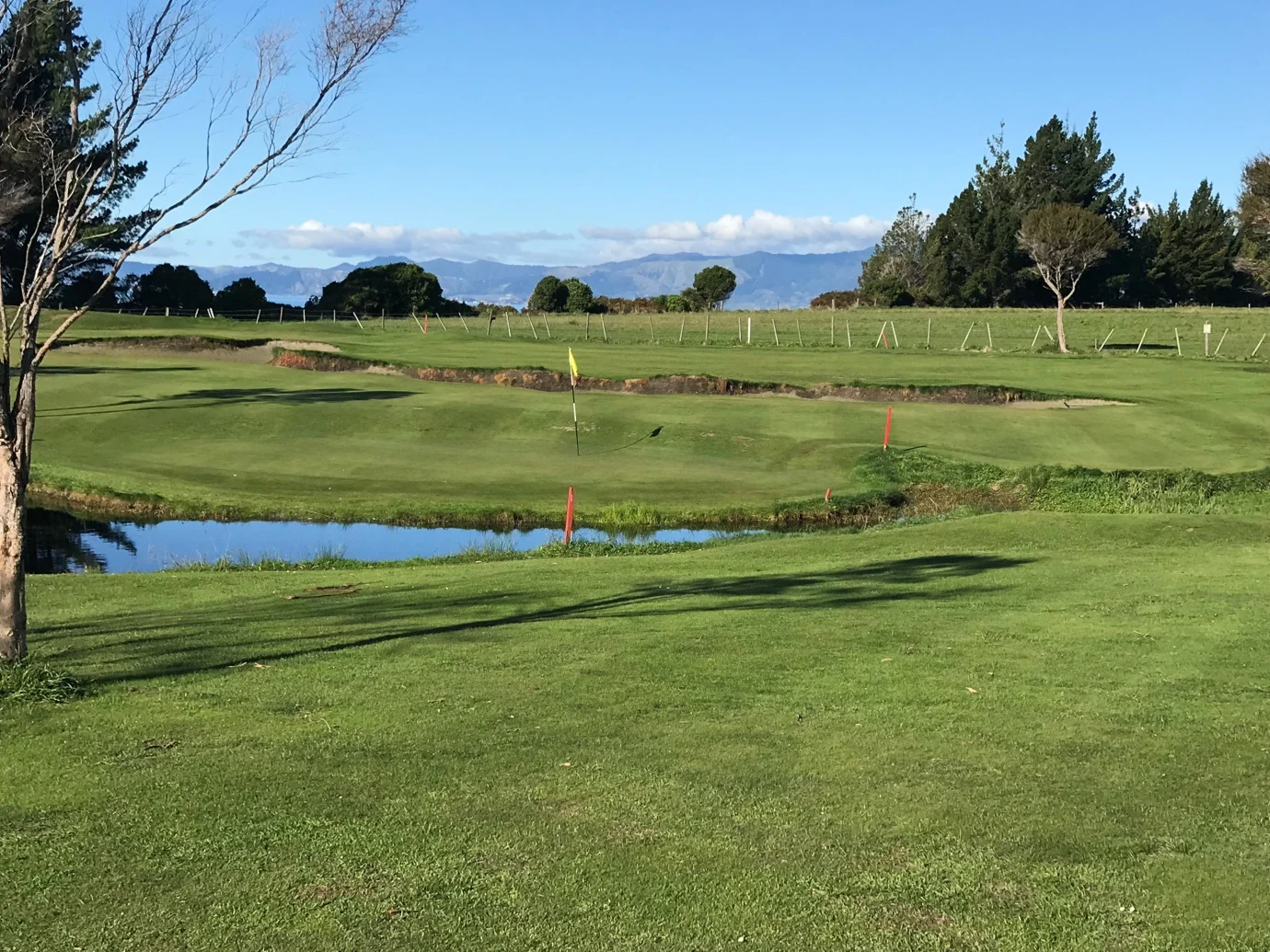 Second shot - pond in front, split level green and bunker behind