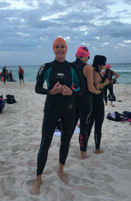 Gini Fellows, who’s competing in Ironman Florida on November 5, 2016, on Panama City Beach getting ready for a practice swim in the Gulf of Mexico