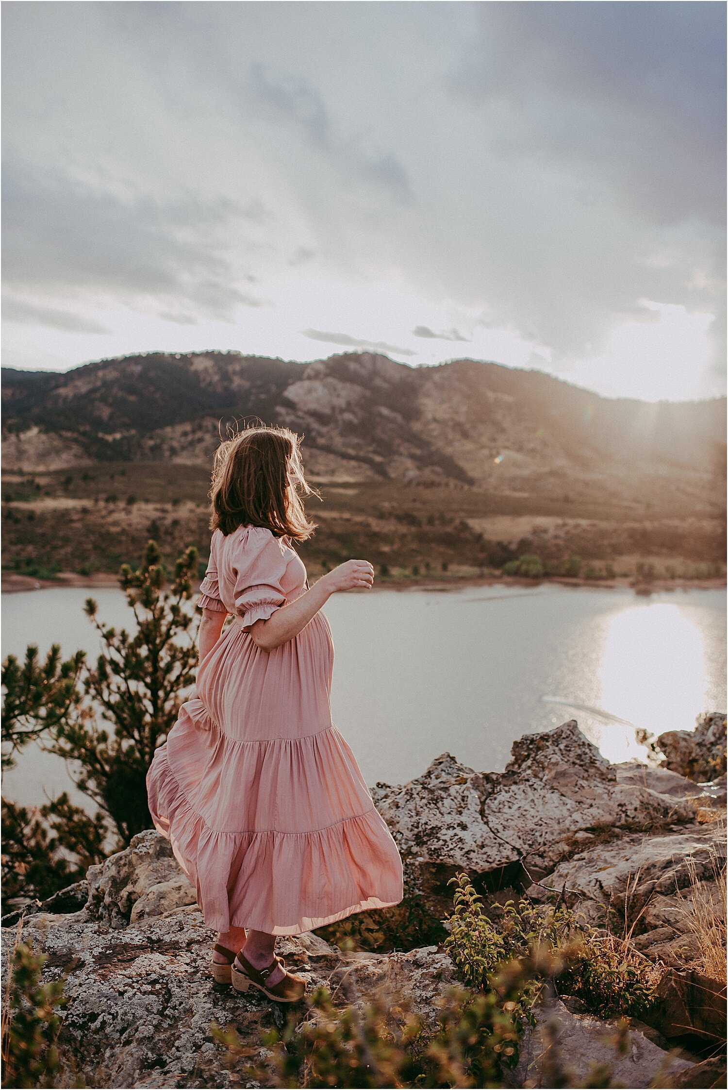  Dramatic photo of pink maternity dress by Roolee during Horsetooth Reservoir maternity session by Sunshine Lady Photography. 