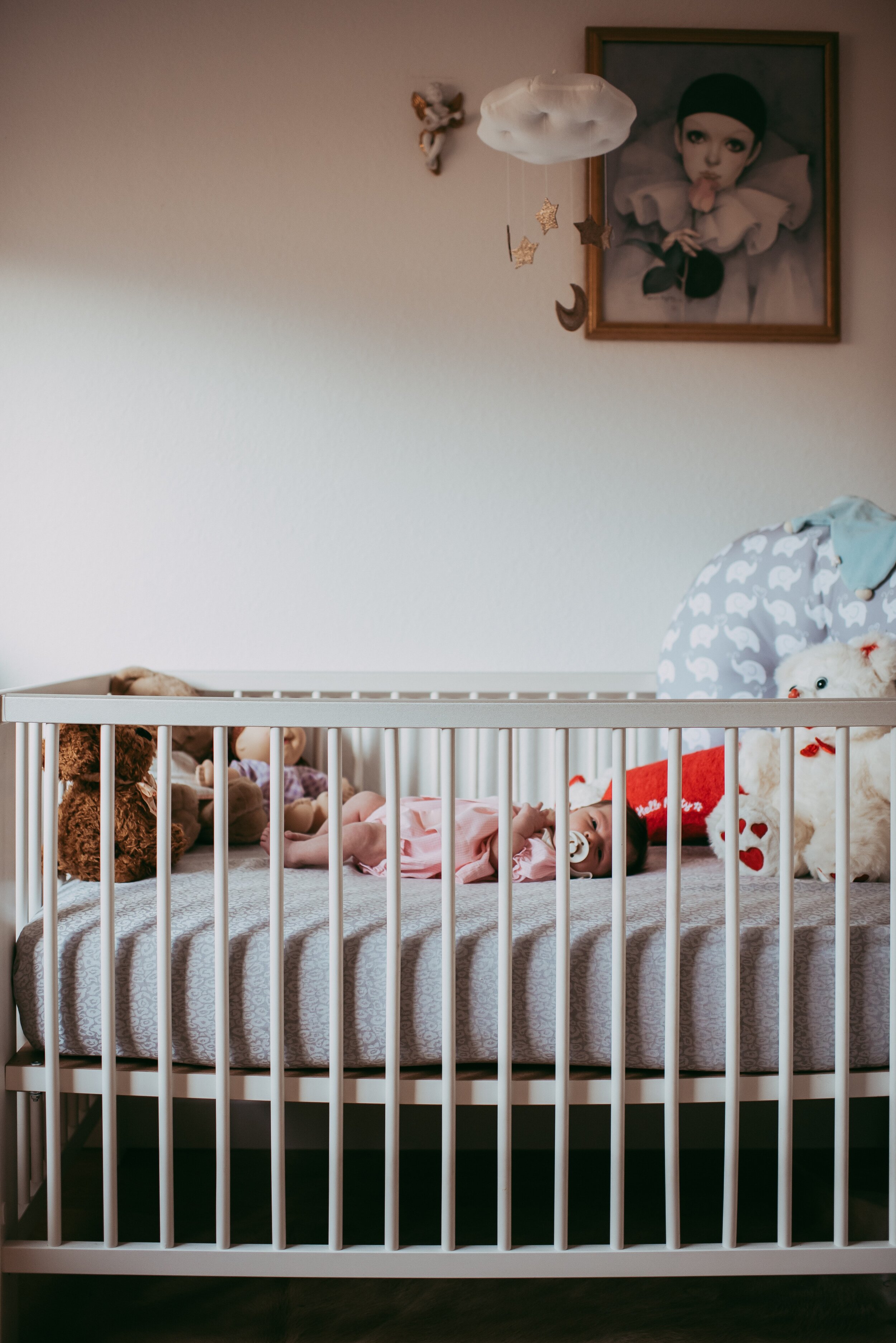 Newborn baby in Jenny Lind crib