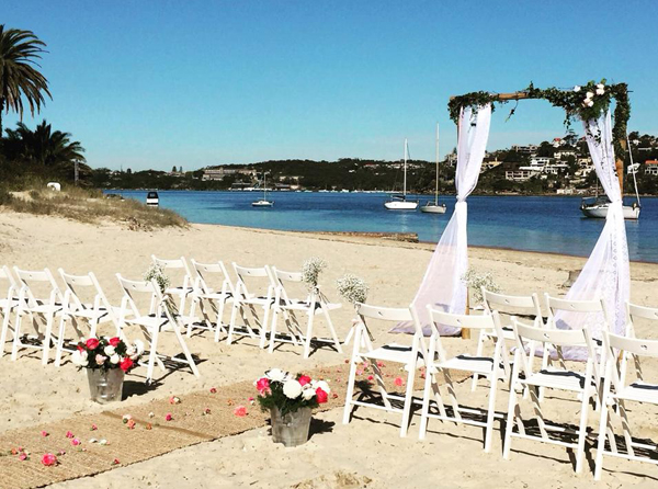 A beautiful Beach Ceremony Set up by Waves & Weddings