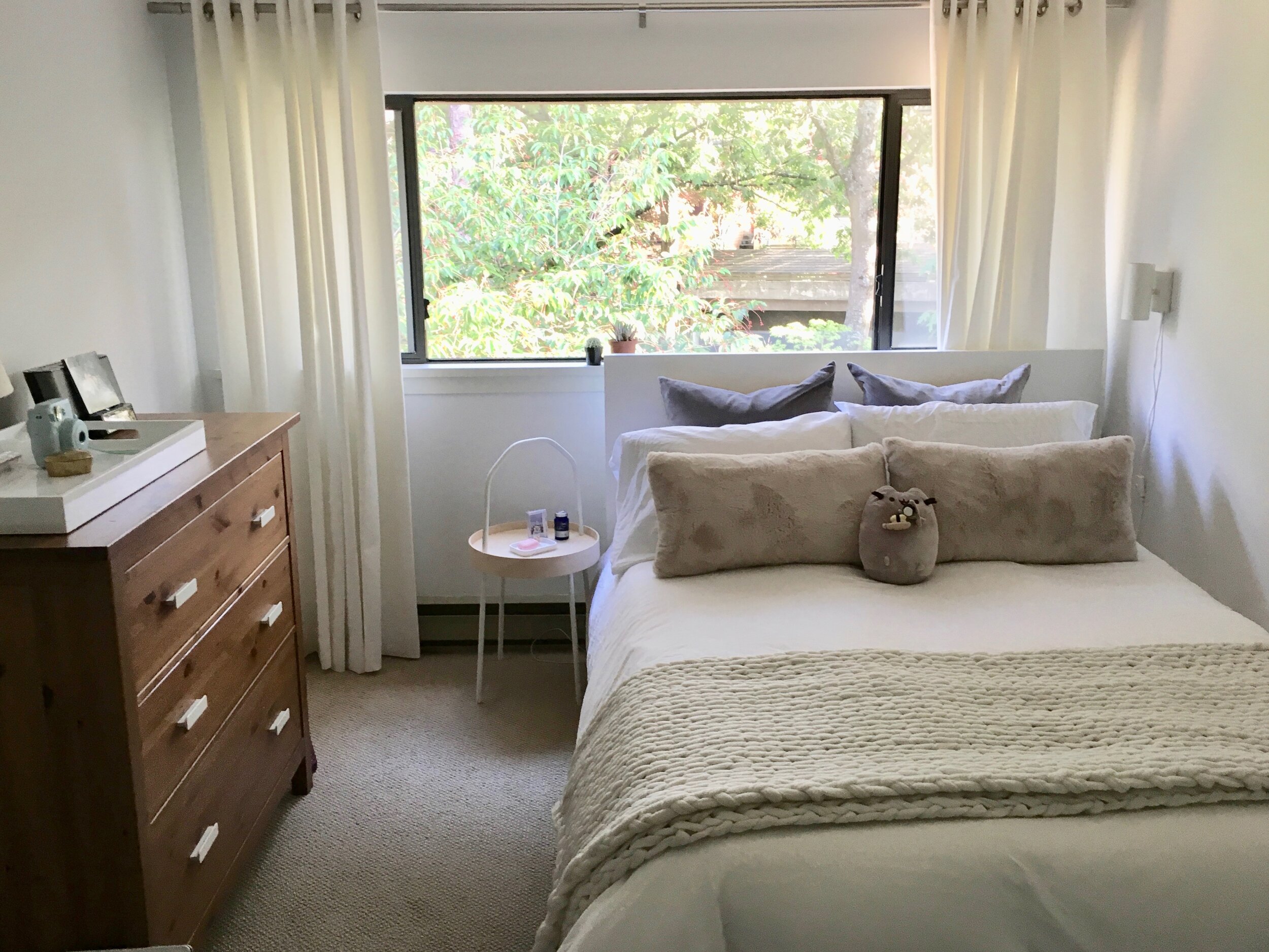 View of finished room with bed and view of window.