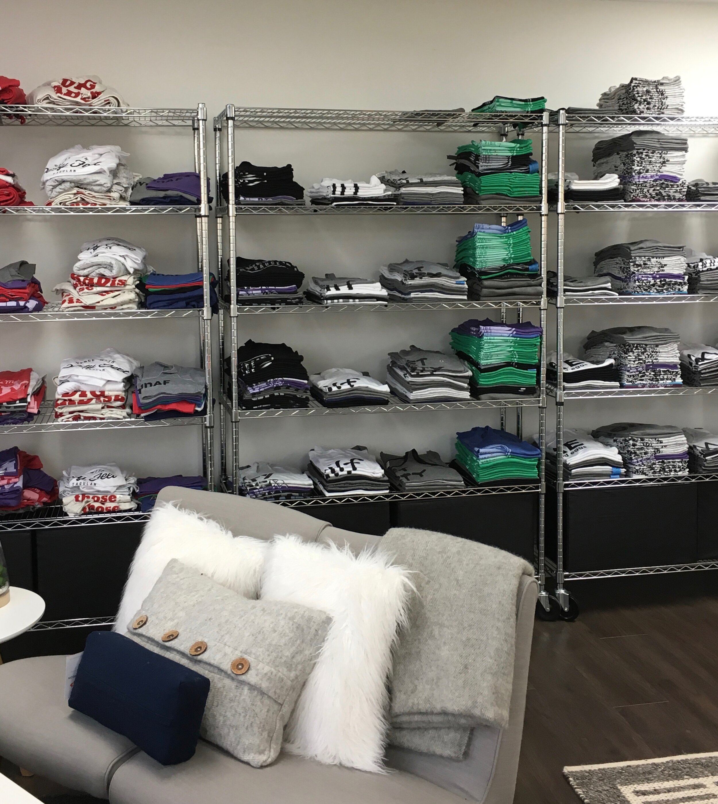 Clothing storage on large industrial chrome racks.