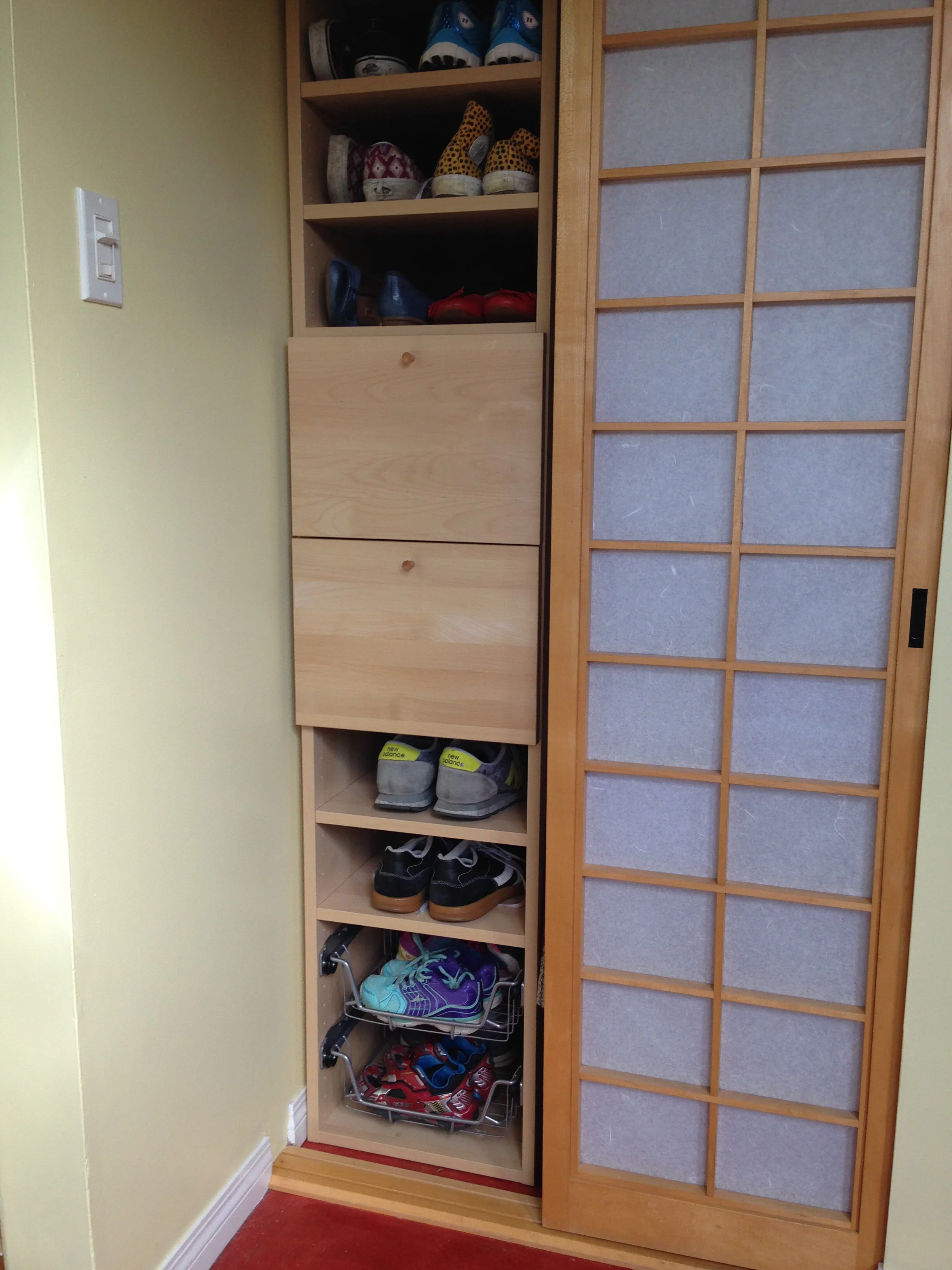 Front hall closet storage added to clean up clutter and organize small accessories.