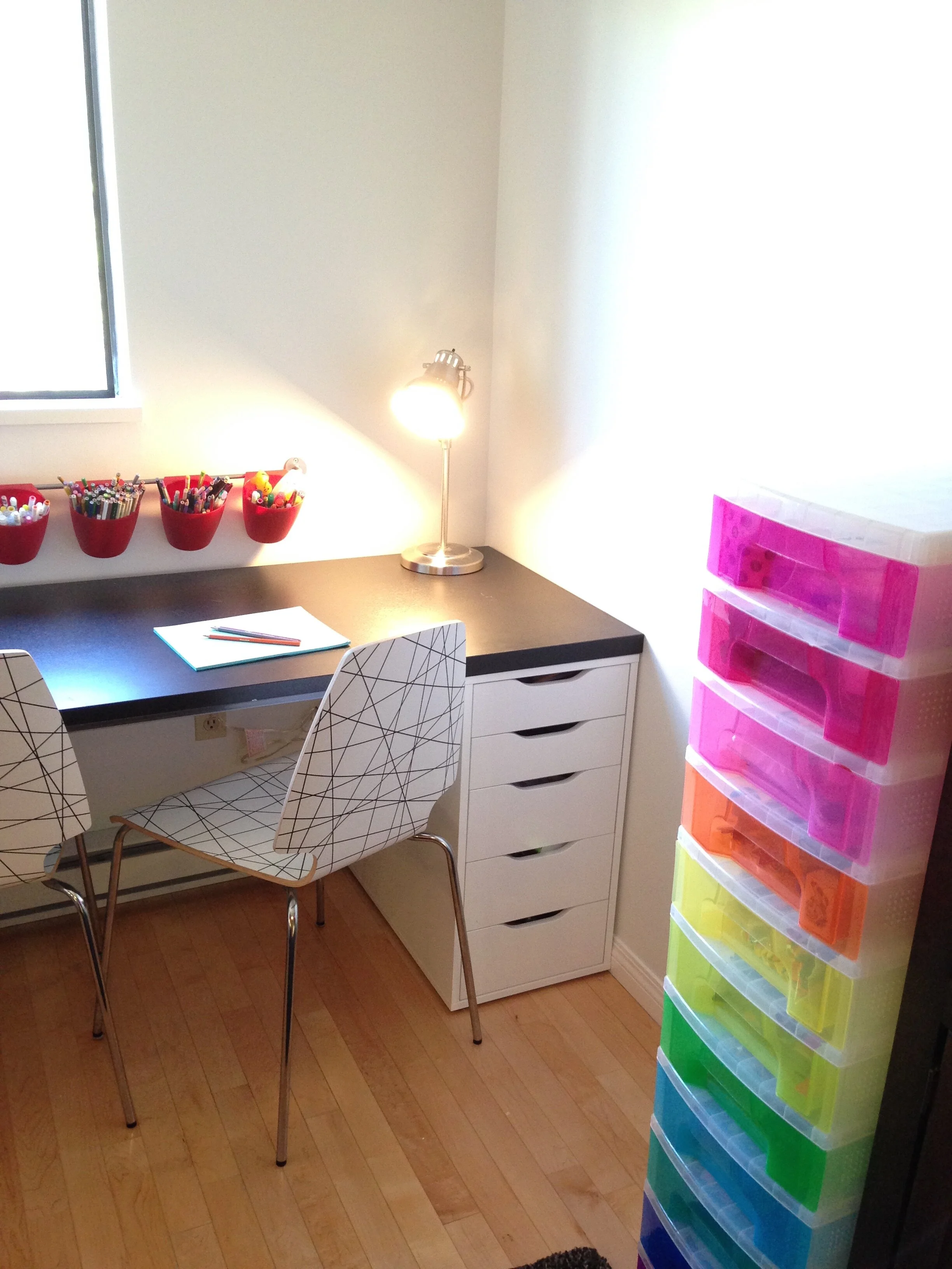 Playful coloured organizing bin and wall storage for kids coloured pencils and crayons.