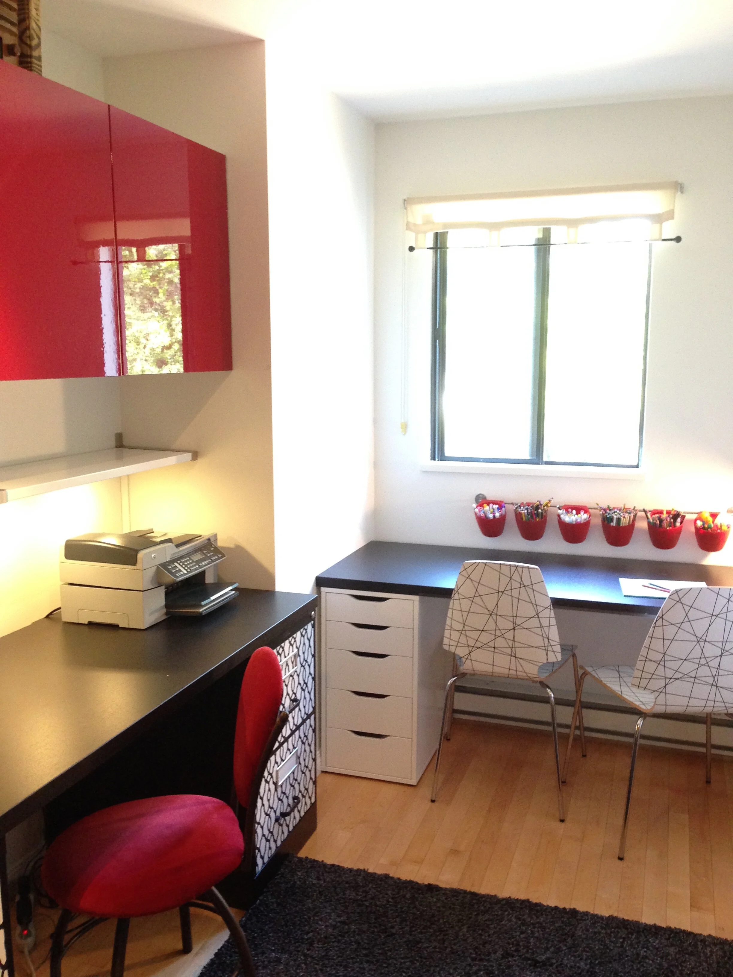 Home office with storage and filing cabinets with crafting desk for kids.