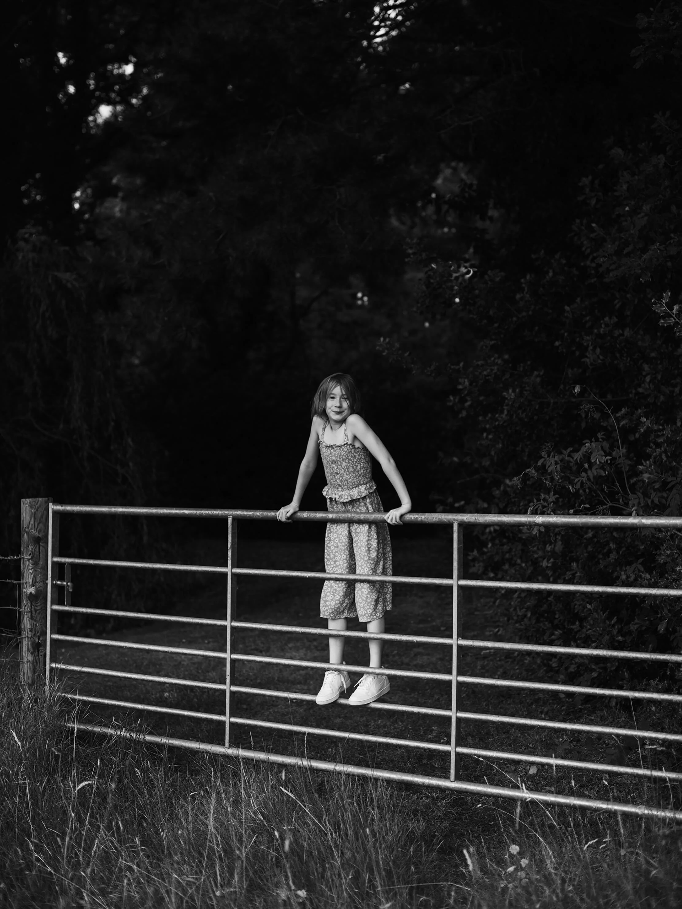Standing on a gate feels like catching joy in its simplest form, a balance between mischief and wonder.

Feet finding their place, hands gripping the bar, eyes fixed on whatever lies beyond like it&rsquo;s the only thing that matters in that moment.
