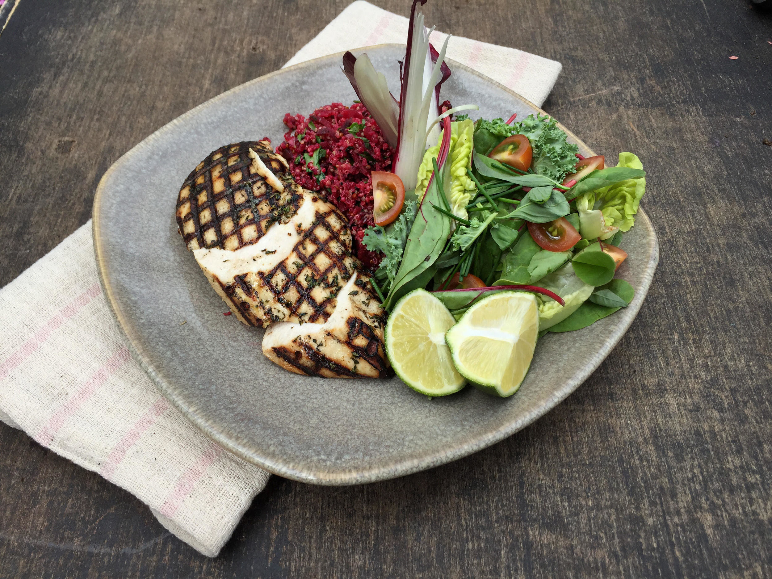 Dinner of grilled lime and chilli chicken with beetroot quinoa and a green baby leaf salad