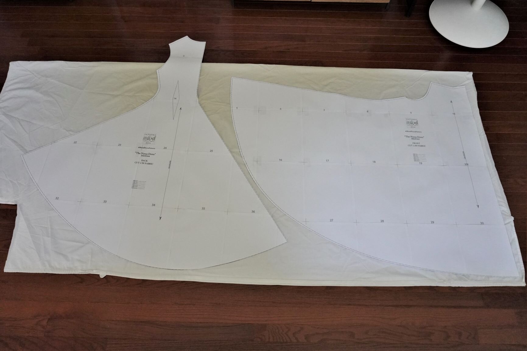 I could not get the front piece to fit on my queen-sized fitted sheet, so I cut the bodice section separately using the leftover fabric in the upper left-hand corner of the sheet.