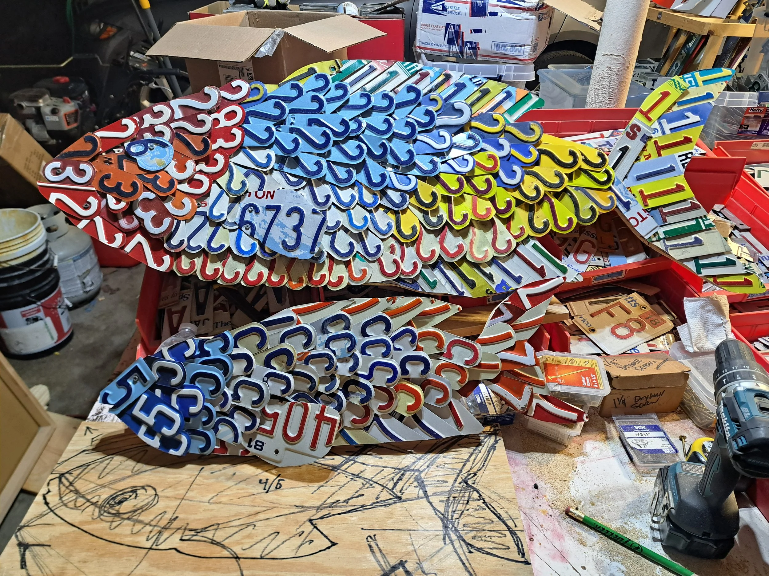 Top fish is 48 inches, bottom is 26"