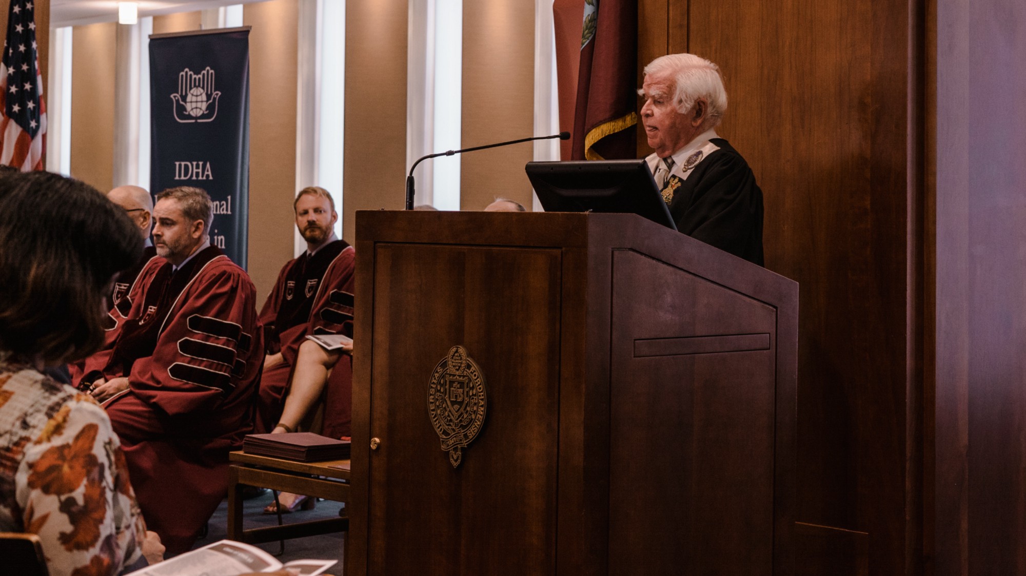 University Professor and Director Kevin M. Cahill, M.D. speaking to IDHA graduates.