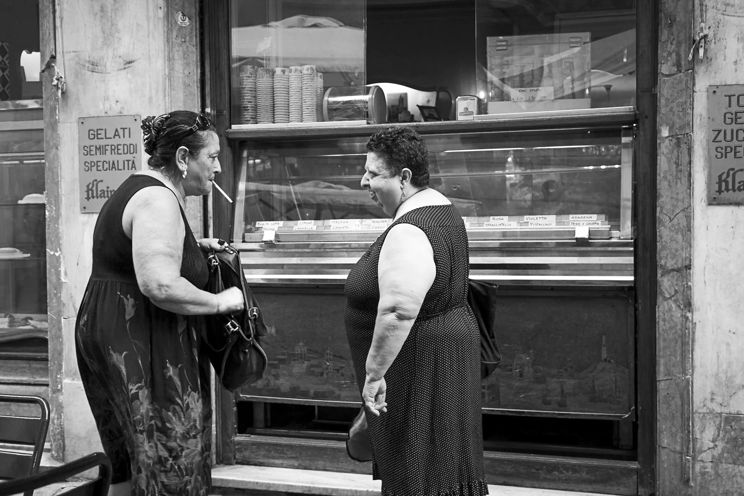 Some locals enjoy a smoke after their morning cafe.