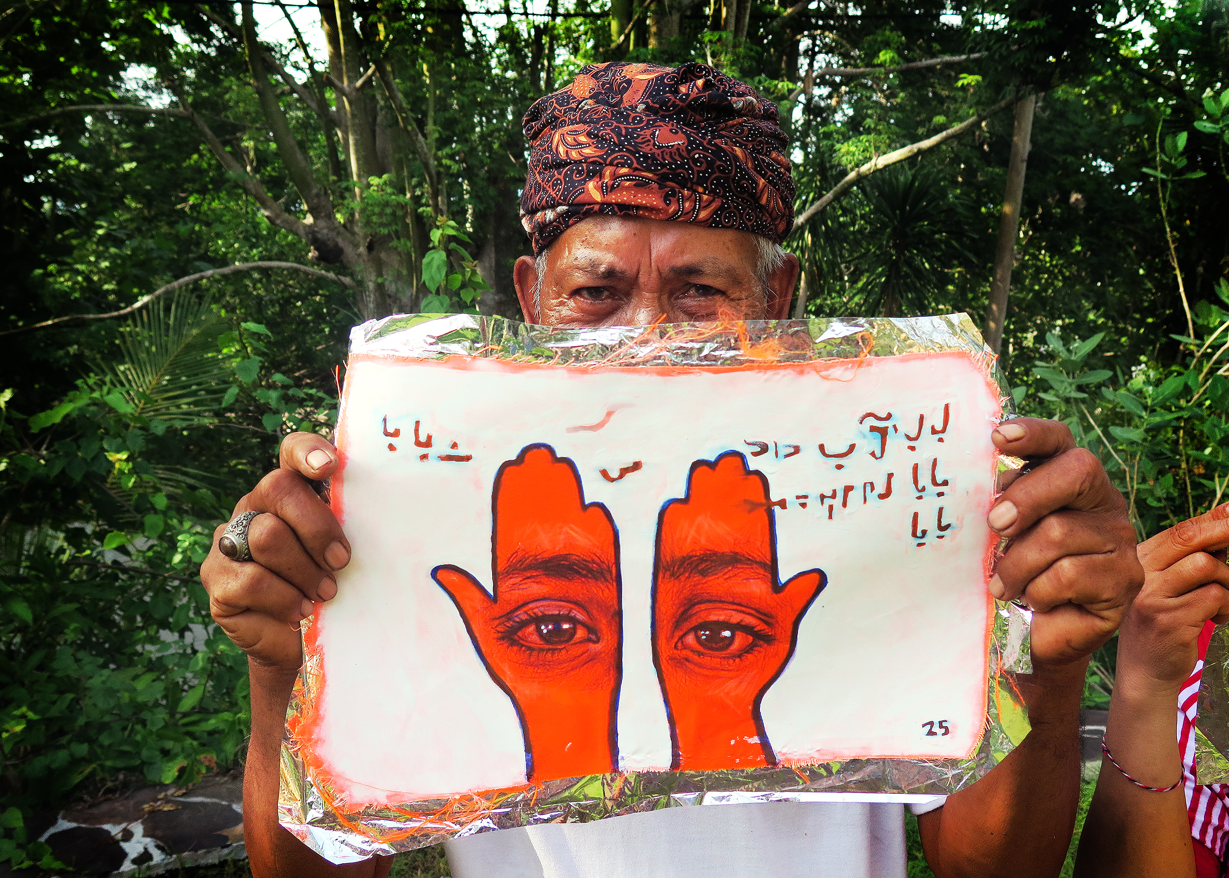 'Khamsa, Sadaqa Jaariyah (Endless Charity): The Refugee Crisis Portrait Project, Balinese Solidarity', 2016. Photo courtesy of artist.