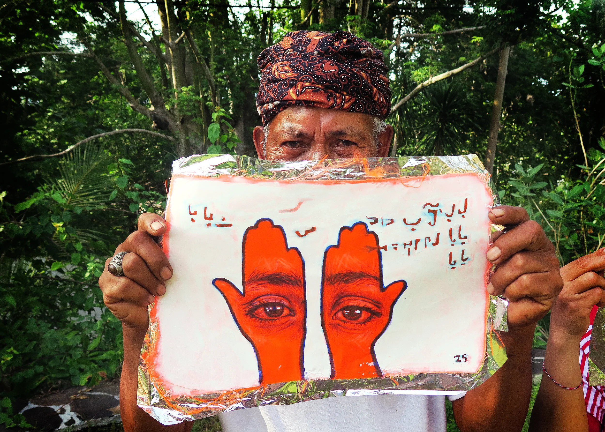 'Khamsa, Sadaqa Jaariyah (Endless Charity): The Refugee Crisis Portrait Project, Balinese Solidarity', 2016. Photo courtesy of artist.