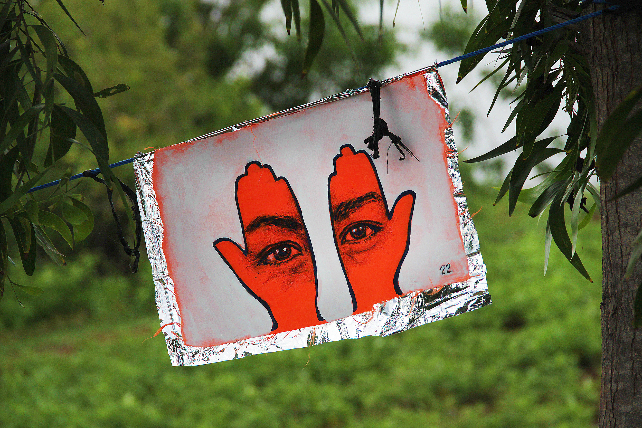 'Khamsa, Sadaqa Jaariyah (Endless Charity): The Refugee Crisis Portrait Project, Lombok Installation', 2016. Photo courtesy of artist.