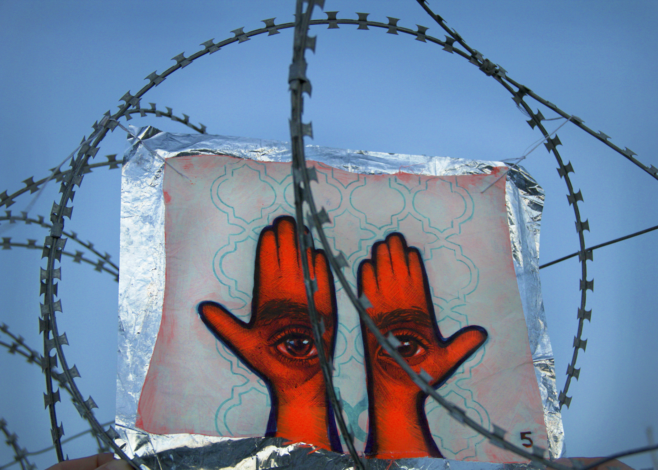 'Khamsa, Sadaqa Jaariyah (Endless Charity): The Refugee Crisis Portrait Project, Port of Lesvos', 2016. Photo courtesy of artist.
