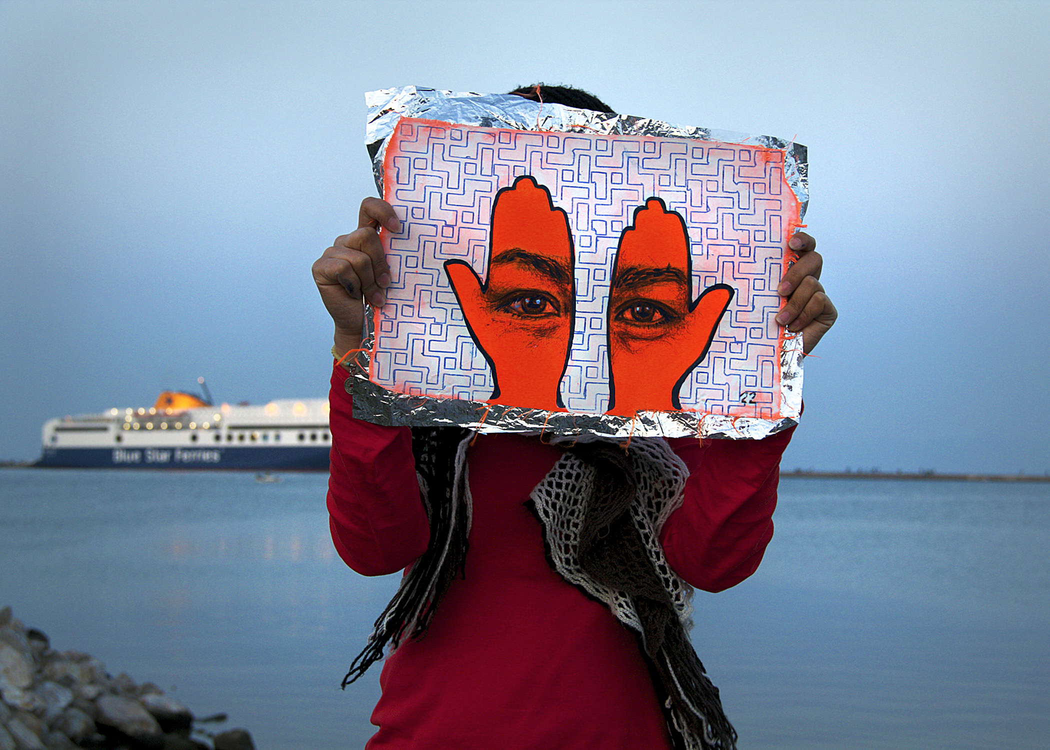 'Khamsa, Sadaqa Jaariyah (Endless Charity): The Refugee Crisis Portrait Project, Port of Lesvos', 2016. Photo courtesy of artist.