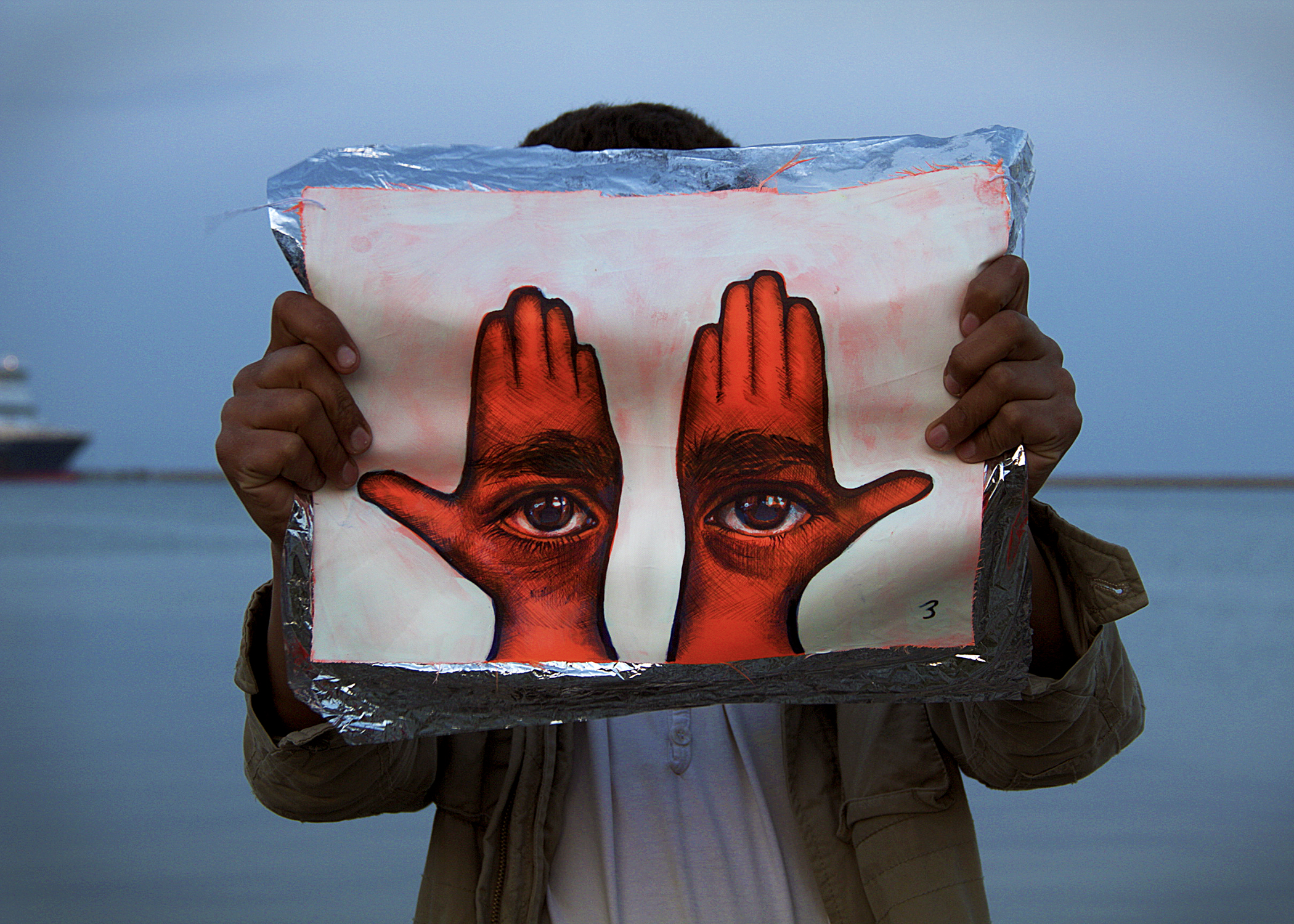 'Khamsa, Sadaqa Jaariyah (Endless Charity): The Refugee Crisis Portrait Project, Port of Lesvos', 2016. Photo courtesy of artist.