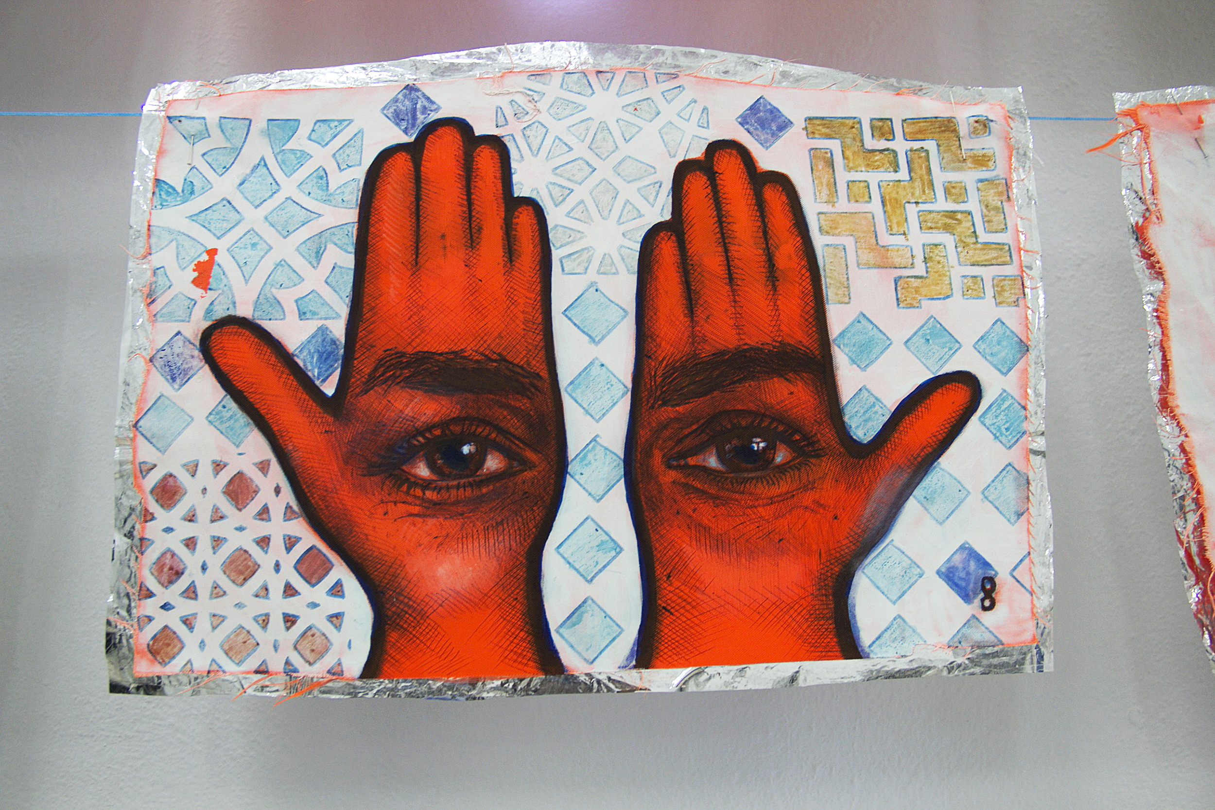 Detail of 'Khamsa, Sadaqa Jaariyah (Endless Charity): The Refugee Crisis Portrait Project' at International Fine Arts Consortium (IFAC) Athina, 2016. Photo courtesy of artist.