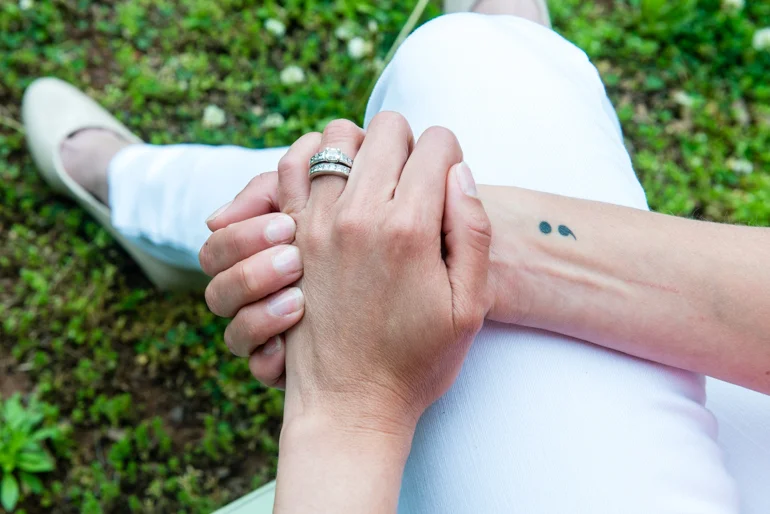 Powell has a semicolon tattoo on her right wrist. The tattoo refers to Project Semicolon, a nonprofit that aims to provide hope for those struggling with mental illness. (HEIDI DE MARCO / KHN)