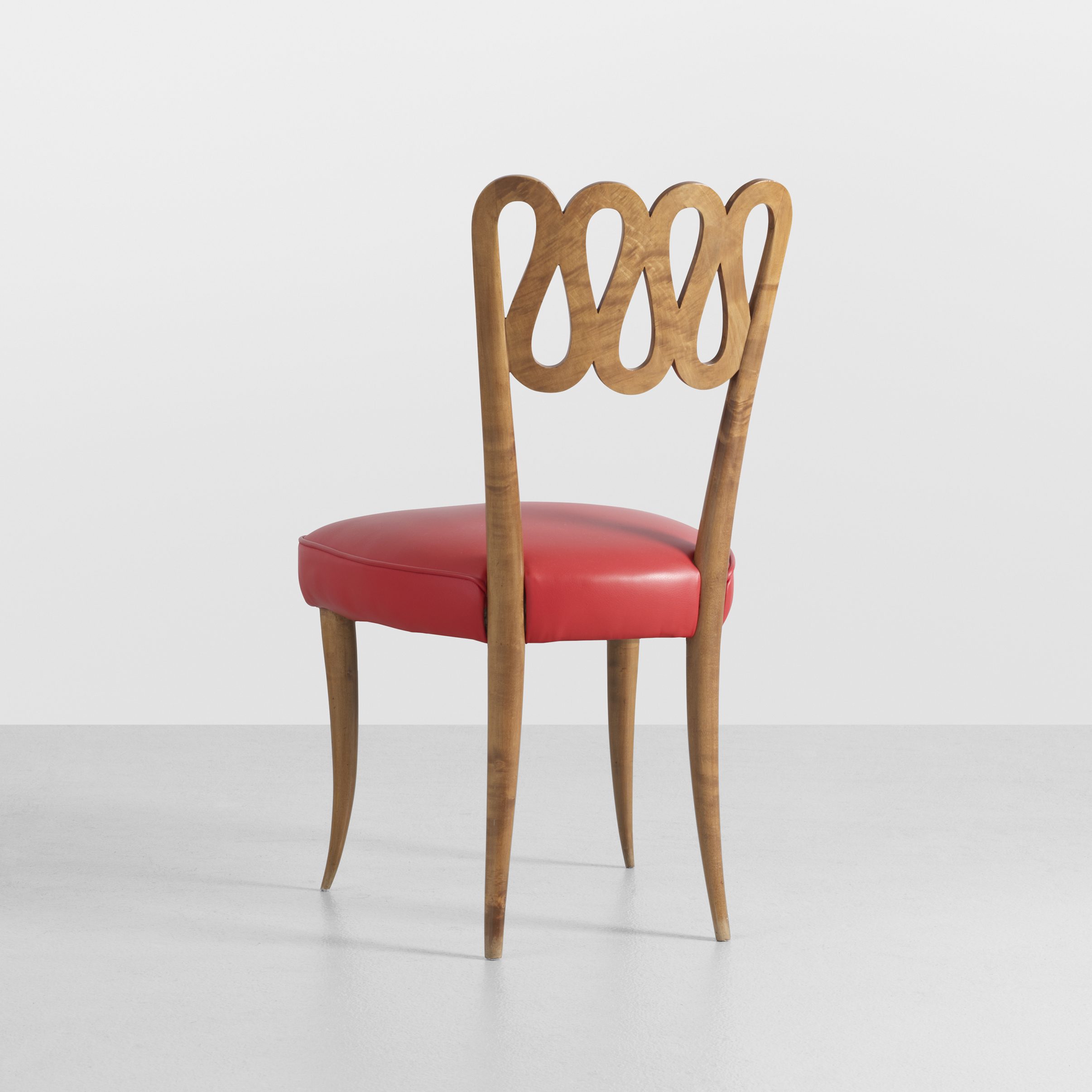 Giò Ponti (Italian, 1891–1979) Scrolled chair from the Contini Bonacossi residence, Florence, 1931 Made by Mario Quarti Italian walnut and leather Private collection