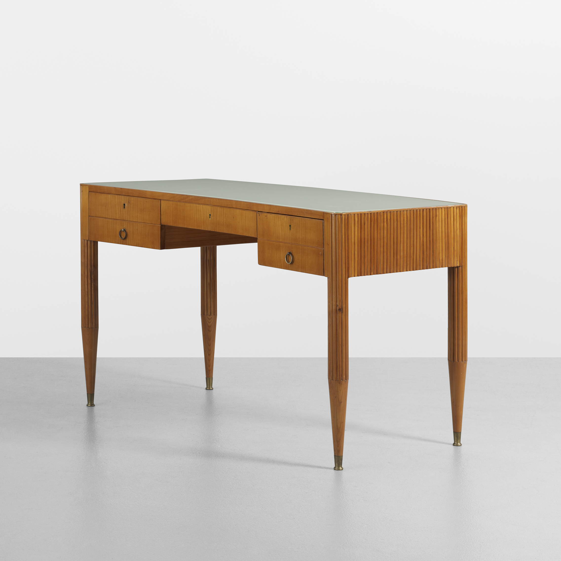 Giò Ponti (Italian, 1891–1979) Desk, 1938 Fruitwood, reverse-painted glass, and brass 31 x 53 x 26 1/2 inches Private collection