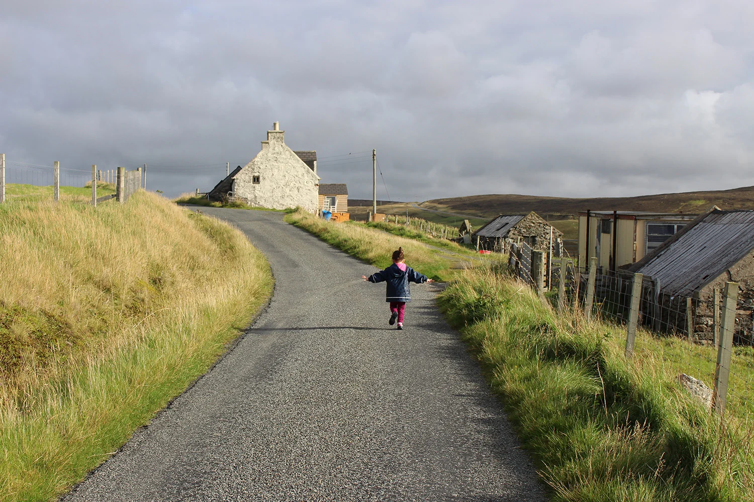 Love this photo of my niece! She loves being at the 'holiday hoose'. On our way up the road to the beach.