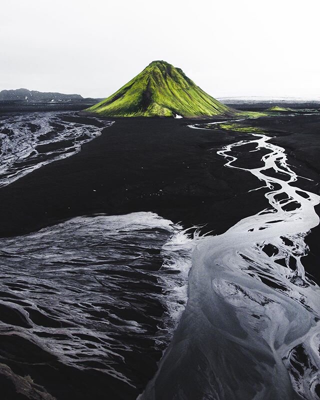 A lonely green hill. Is it a hill? Maybe it&rsquo;s a mountain. Does anybody really know? 🙃 #Iceland