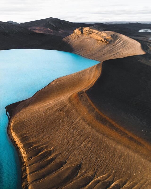 Smooth lines. Iceland is a place where the smooth and the rough live side by side, feeding one another. Glistening water and incredible hues, with the run off down the slope creating a fractal complexity that really asks, even demands a deeper look. 