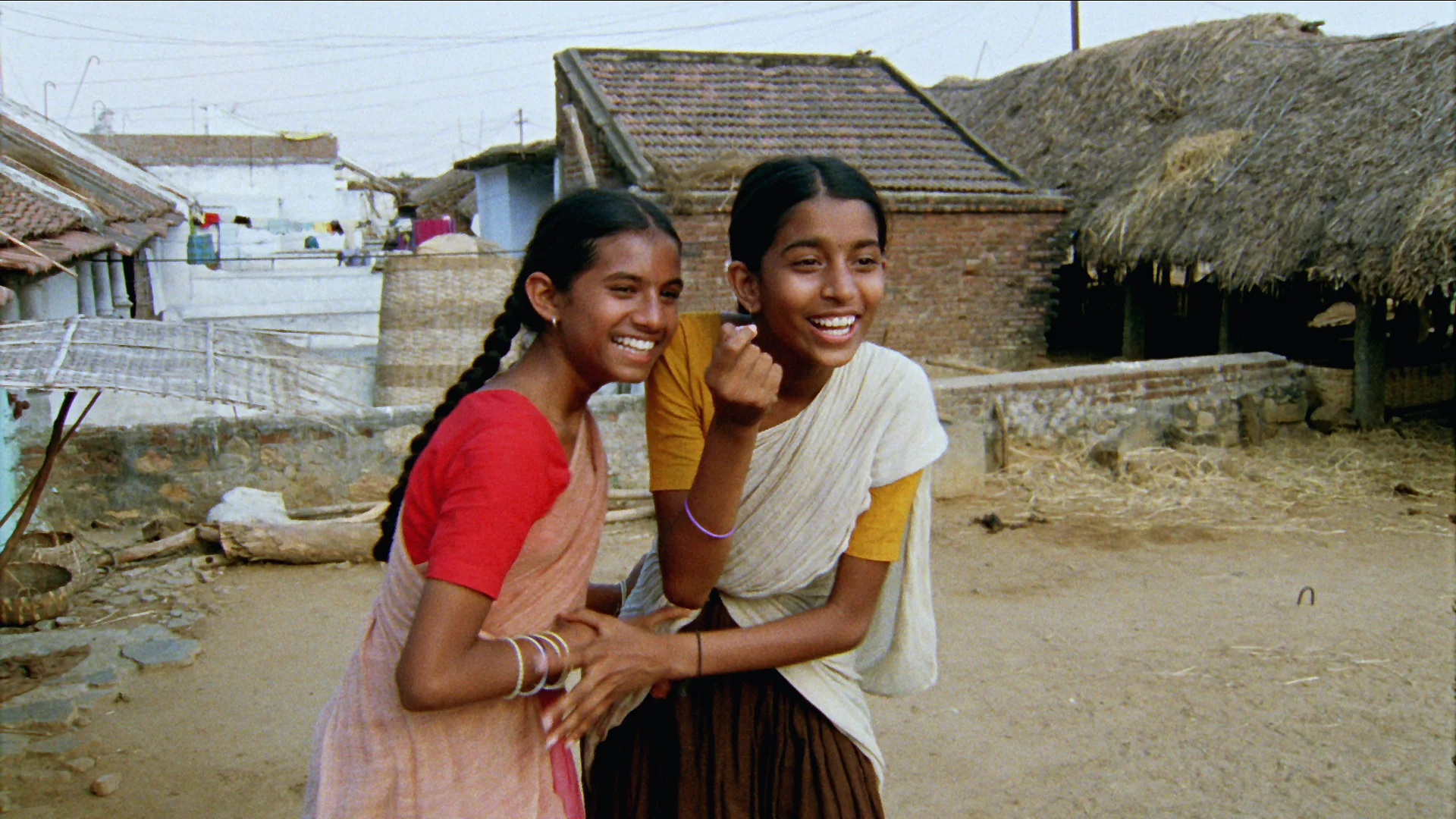 Vanaja and Lacchi ridiculing Ram Babu.jpg