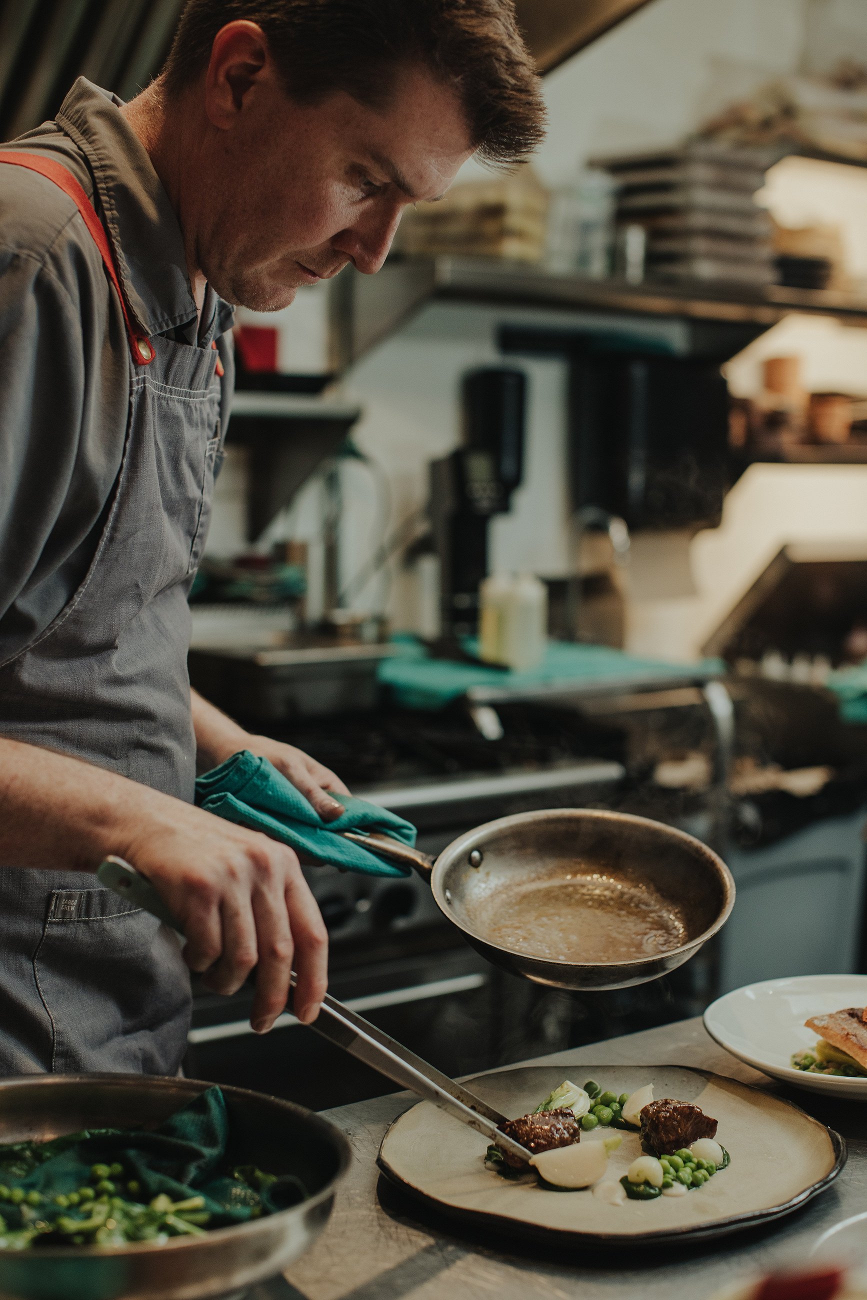 Pluvio - The Apartment Photo - Chef Warren plating.jpg