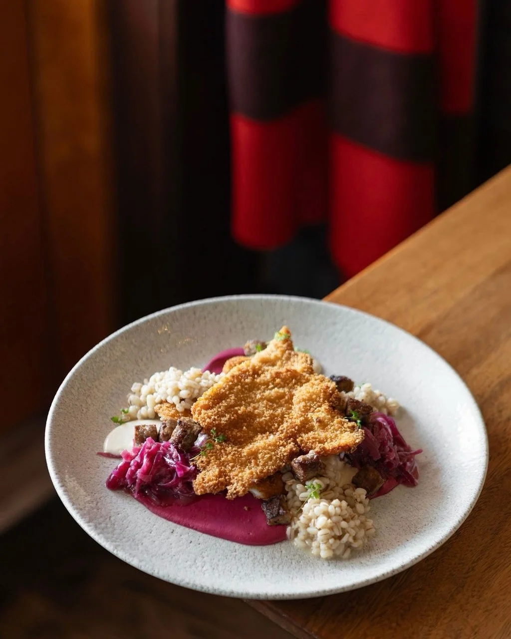 Mid‑week comfort indulgence. Our @mountainviewpoultry_ Chicken Schnitzel hits the table with Sudo Farms red cabbage choucroute, @poplarblufforganics beet pur&eacute;e, barley and @sylvanstarcheese Klondyk Gruy&egrave;re. Join us for lunch or dinner. 