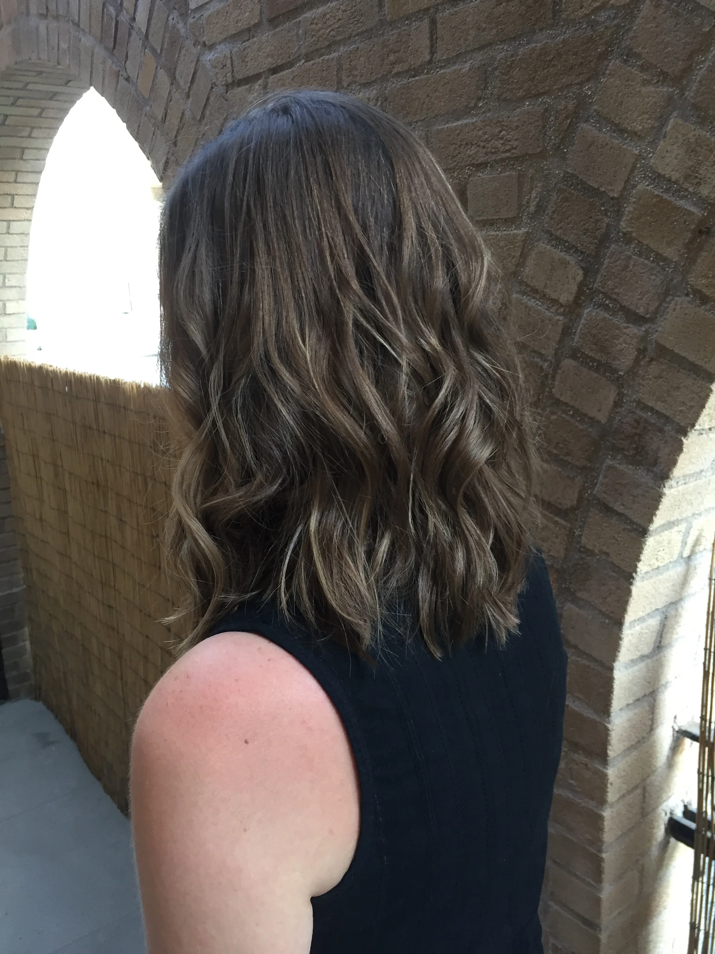  Natural babylights throughout entire head to achieve a sunkissed look. Fresh trim to create fullness with movement throughout. Low maintenance for someone who prefers to go several month between services. 