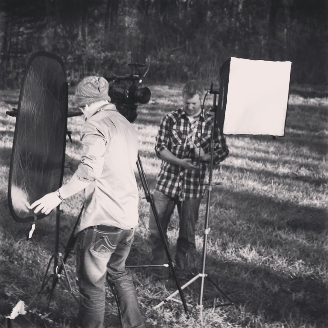 Lights and reflectors and cameras and grass and...
