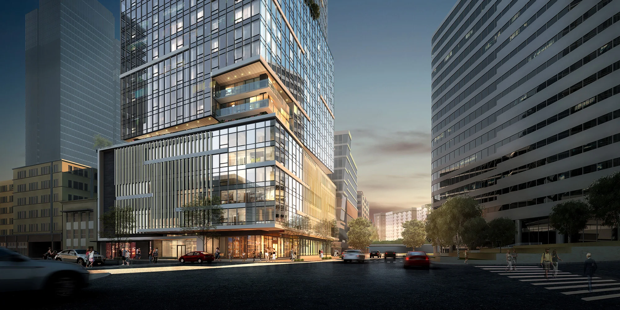 Above: The podium level of the tower rises above a glassy ground level - the five levels of above grade parking are carefully concealed behind a dynamic series of vertical fins that clad the parking while the high-profile corner is activated with work studios and guest suites accessed through the garage.