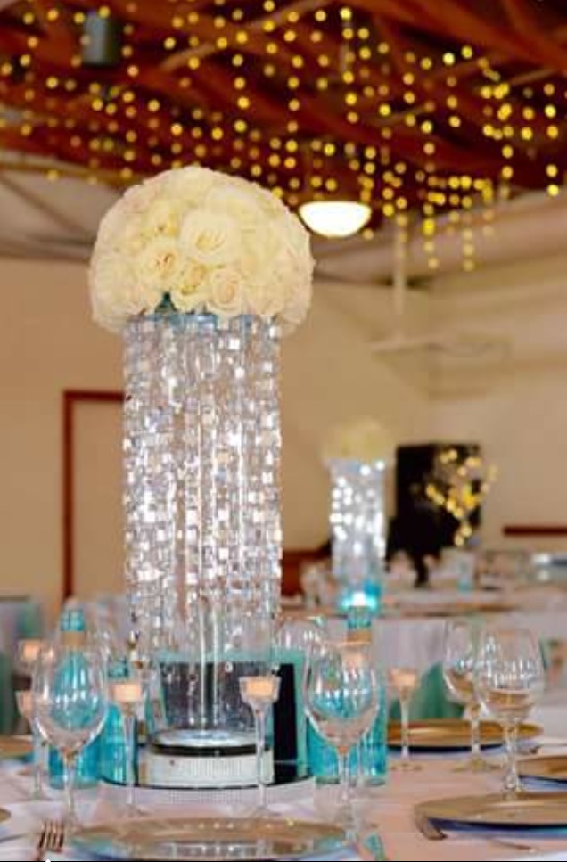 Consist of light up base, cylinder, Bling And real rose Centerpiece