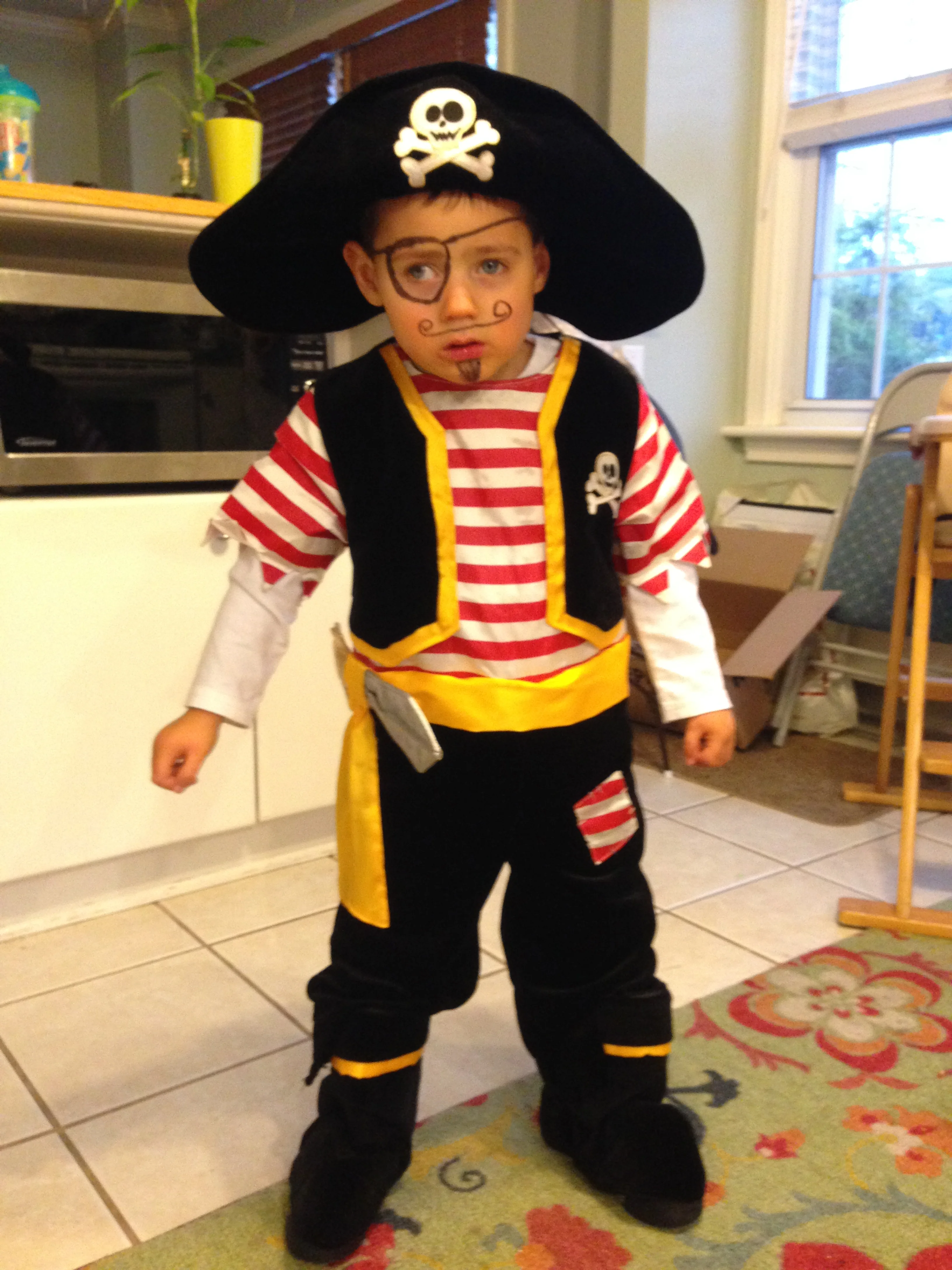 He was able to stand and take a couple steps without assistance by Halloween 2013. My little pirate! 