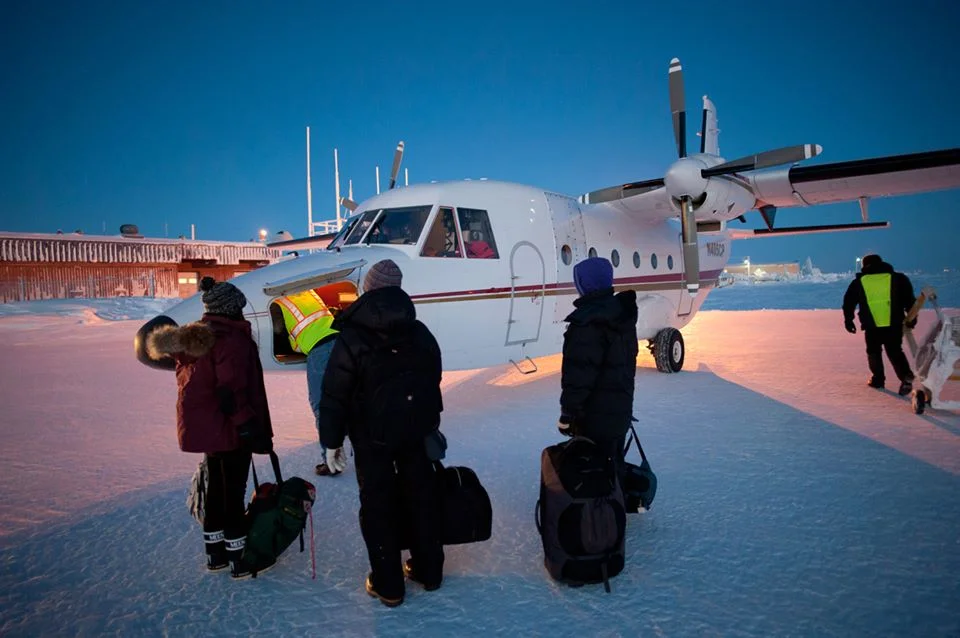 Shannon Williams, Liz Sears, and Raena Schraer of SRB&A preparing to board plane for fieldwork on Alaska’s North Slope. Photo Credit – Chad Cook.
