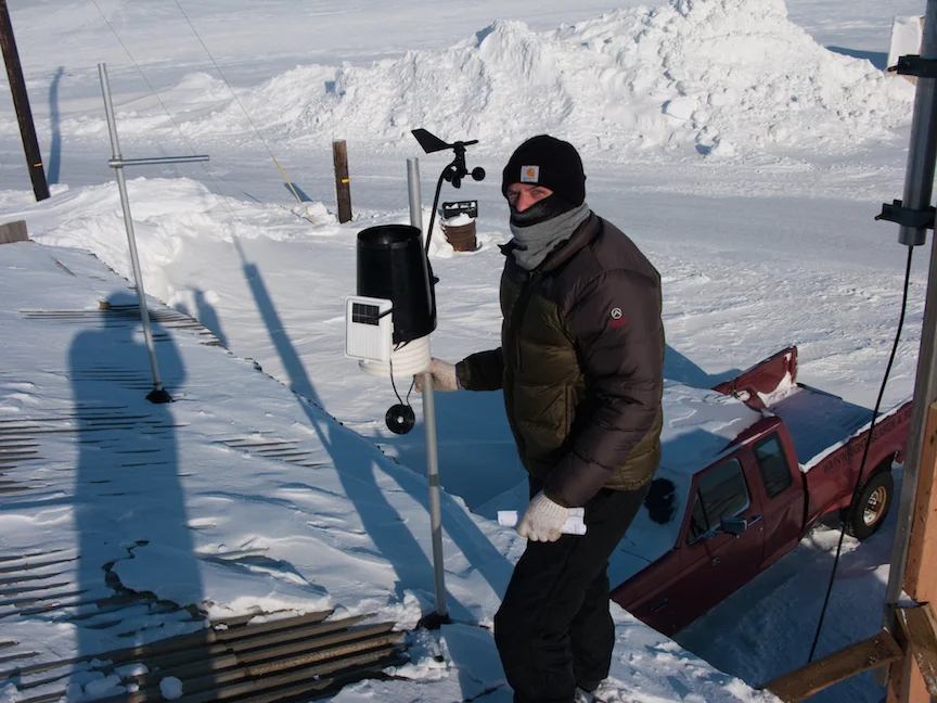 Paul Lawrence of SRB&A installing a weather station in Wainwright, Alaska to contribute to the understanding of local marine subsistence activities. Photo Credit – Caleb Billmeier.