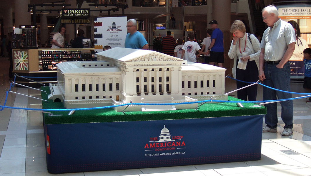 The U.S. Supreme Court Building, 450 hours to assemble at 1:54 scale. I like this photo from the back, because of the people looking on, but the "front entrance" is on the other side, with two LEGO statues and a noticeable yellow/gold door.
