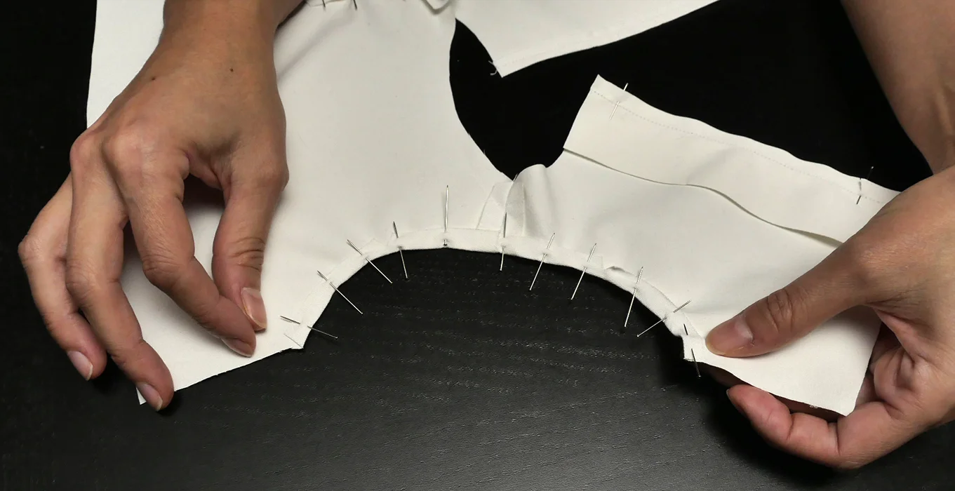 Prepare this edge for a simple hem to create a sleeveless shirt.