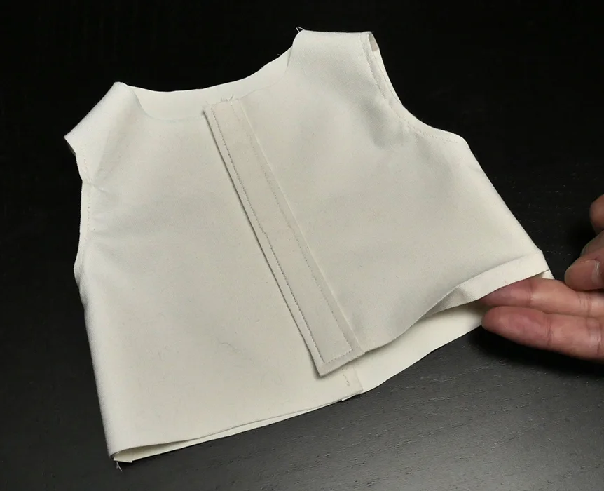 I chose to turn my shirt's hem just a bit under when I ran the topstitching along the button-front, for a more professional looking button-front. This is what it should look like, "right" side out, at this point in the process.
